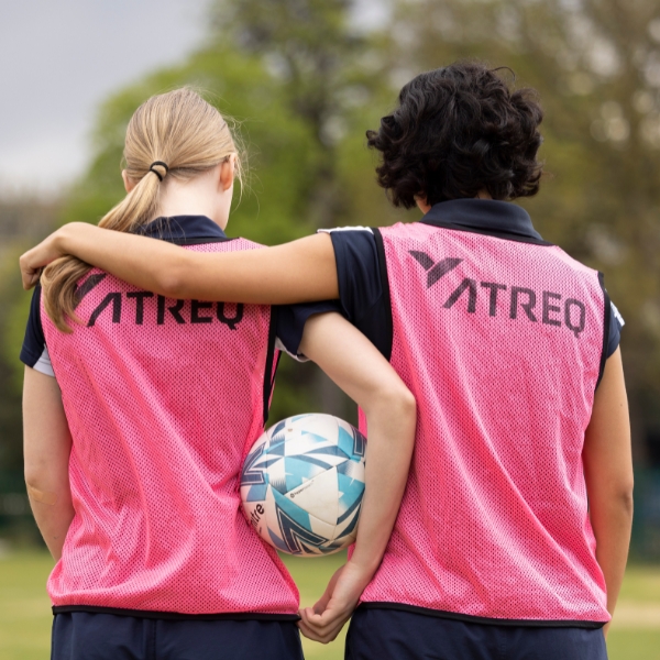 Senior girls football team image from behind.