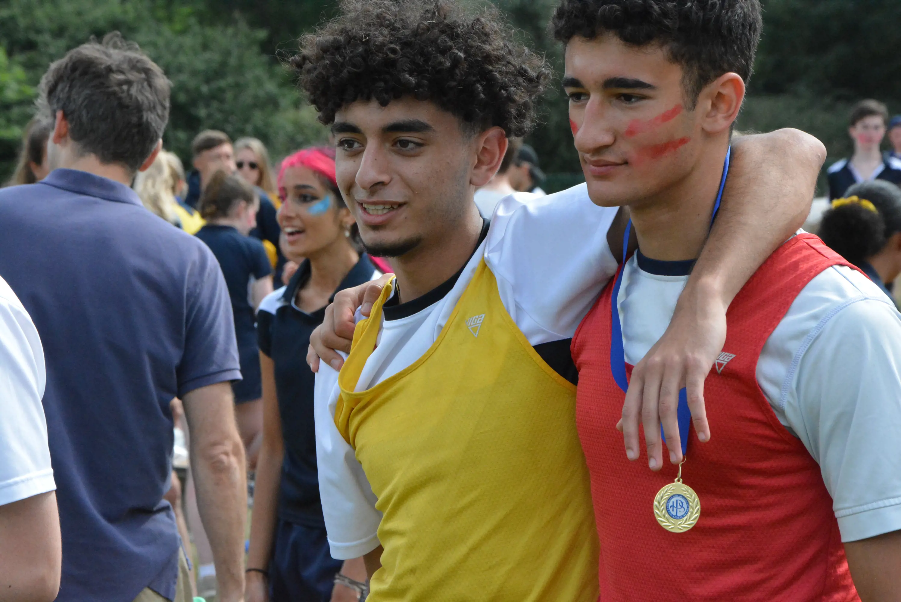 Sixth form pupils with gold medals Ibstock Place School, a private school near Richmond, Barnes, Putney, Kingston, and Wandsworth