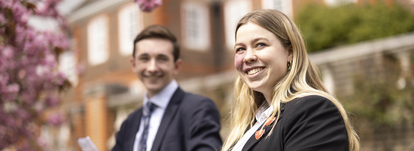 Senior pupils smiling in the campus of Ibstock Place School, a private school near Richmond.