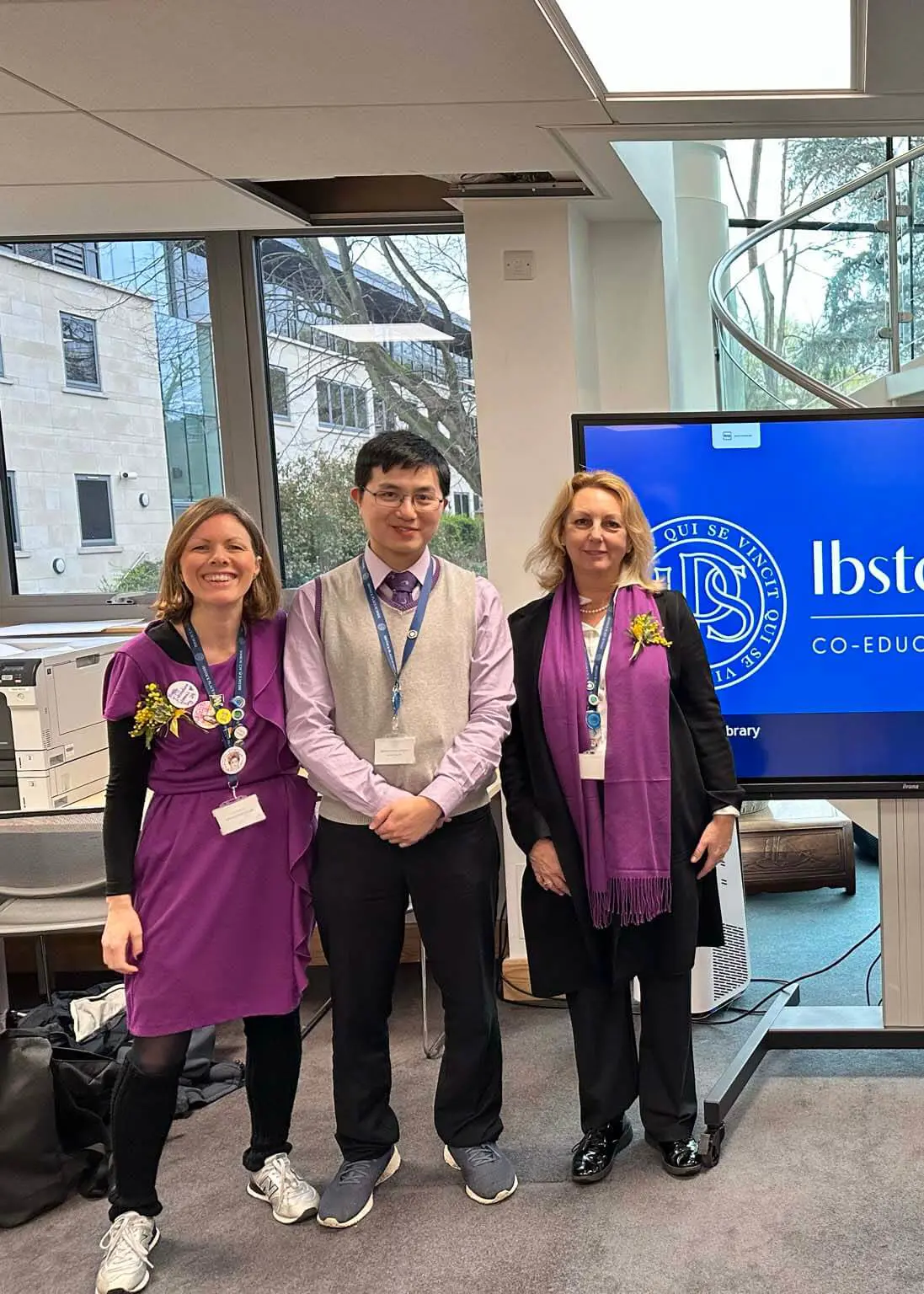 Staff Celebrating International Women's Day by wearing purple at Ibstock Place School, Roehampton, a private school near Richmond, Barnes, Putney, Kingston, & Wandsworth