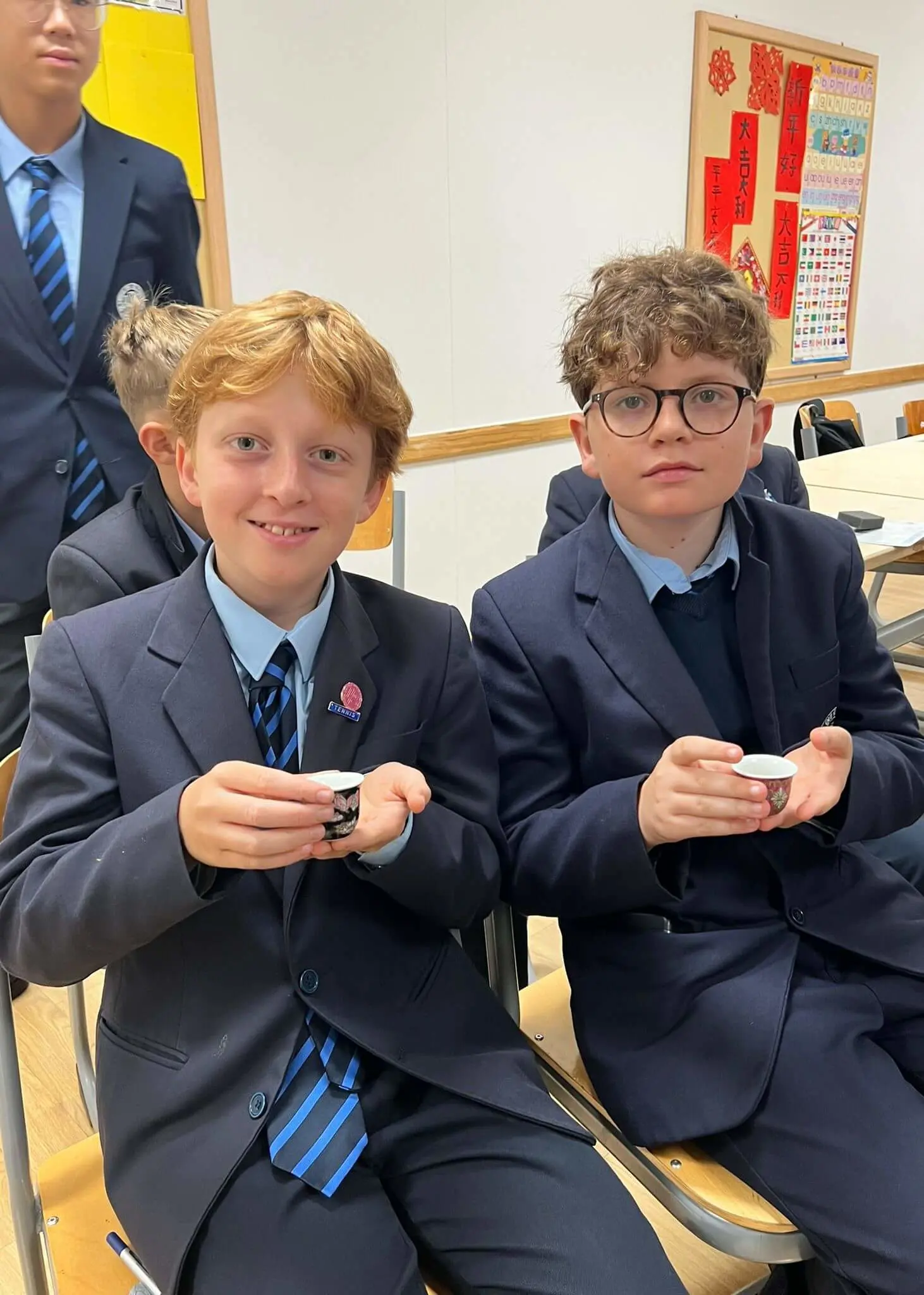 Senior pupils trying Chinese tea at Ibstock Place School, private school near Richmond, Barnes, Putney, Kingston, and Wandsworth on an overseas trip. 