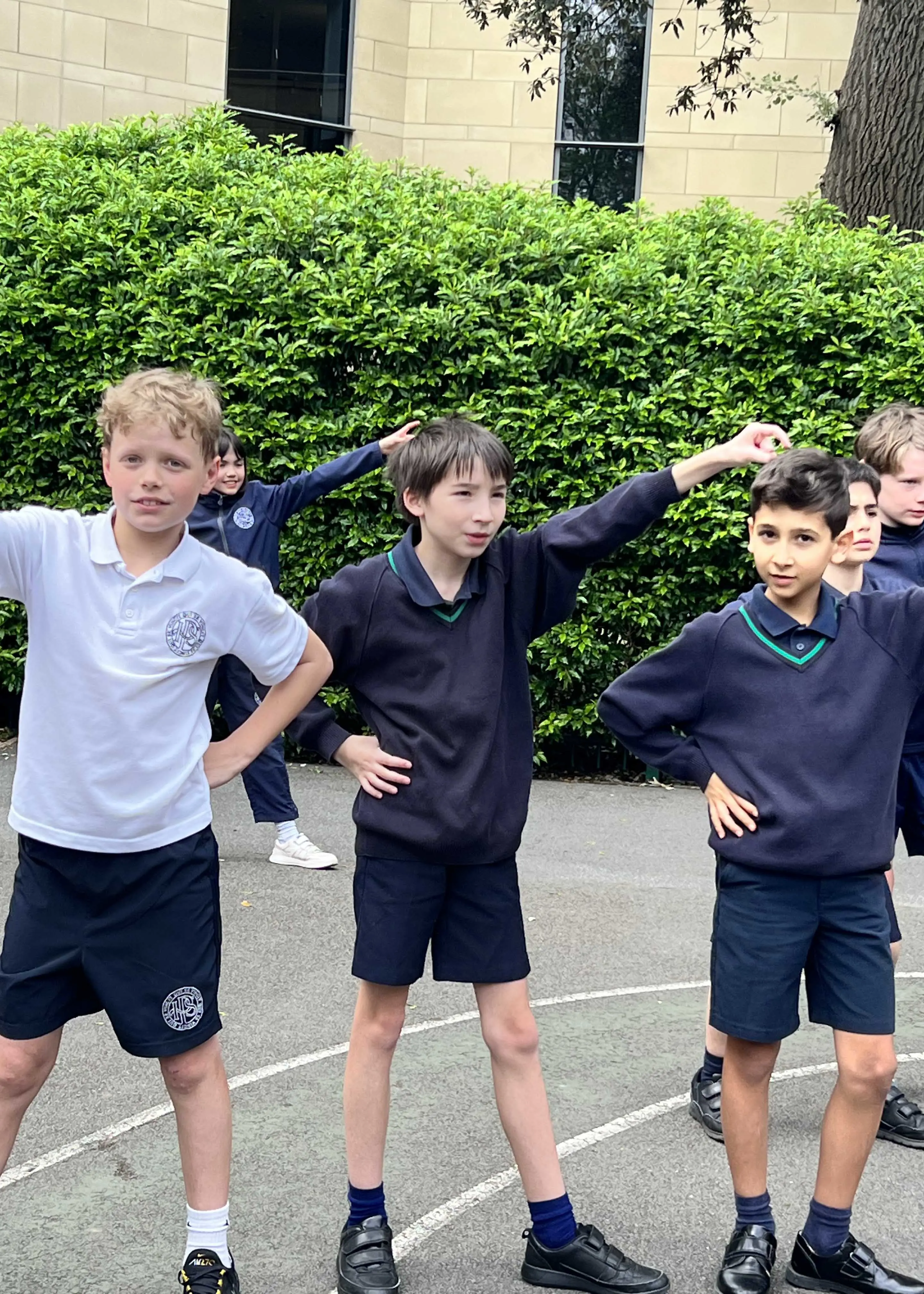 Prep pupils dancing on YMCA for Mental Health Awareness week at Ibstock Place School, a private school near Richmond, Barnes, Putney, Kingston, and Wandsworth on an overseas trip. 