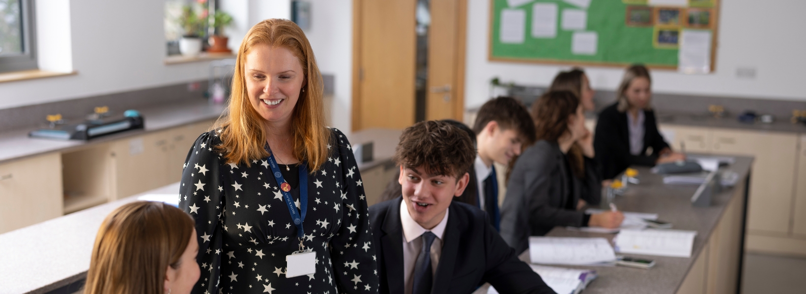 Senior pupils and staff interaction in the classroom of Ibstock Place School, a private school near Richmond.