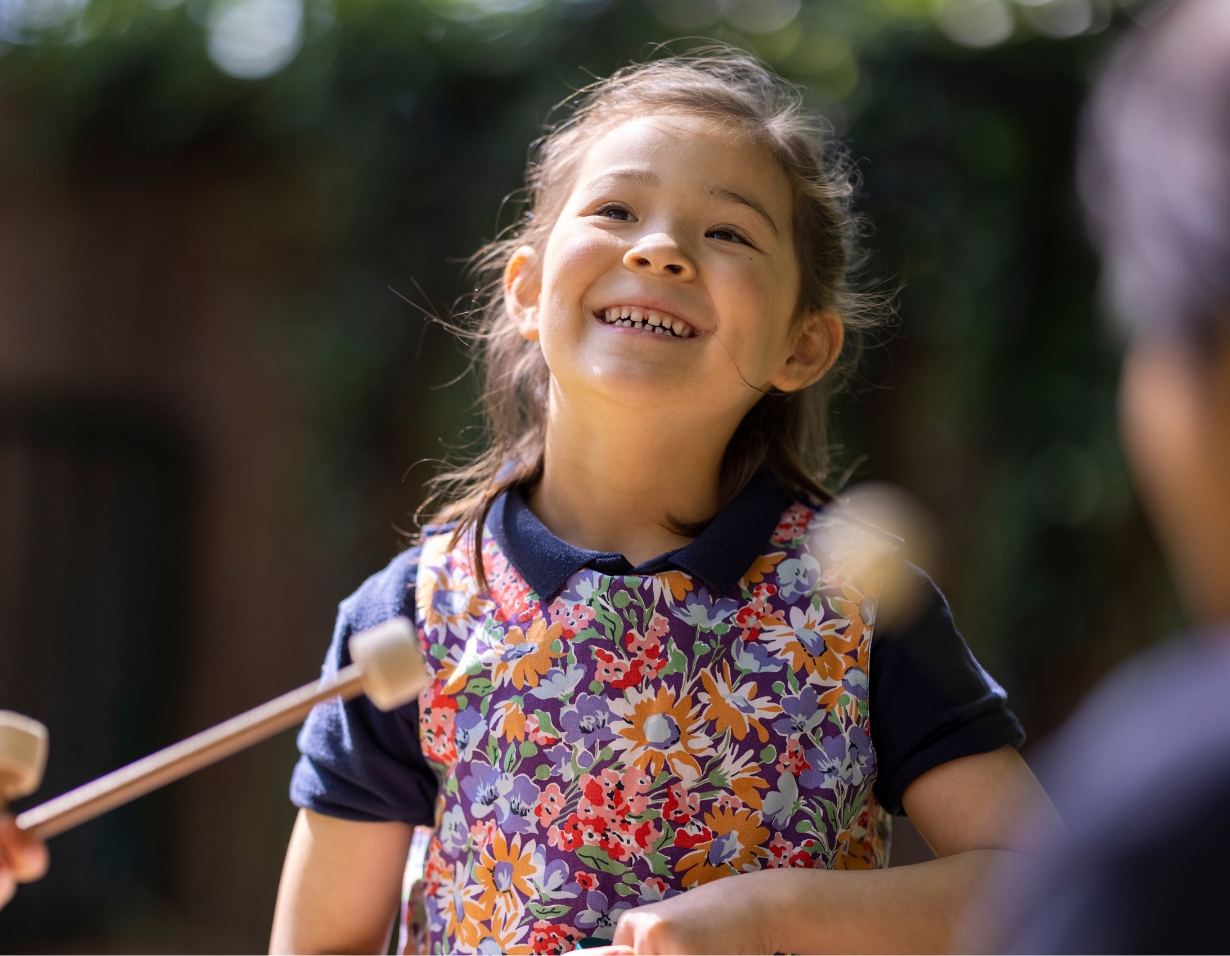 Pre-prep pupils learning music outside the classroom at Ibstock Place School, a private school near Richmond