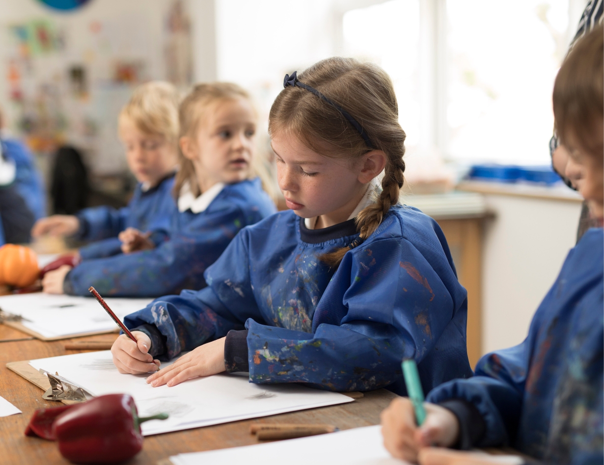 Pre-prep pupils doing an activity in the classroom at Ibstock Place School, a private school near Richmond