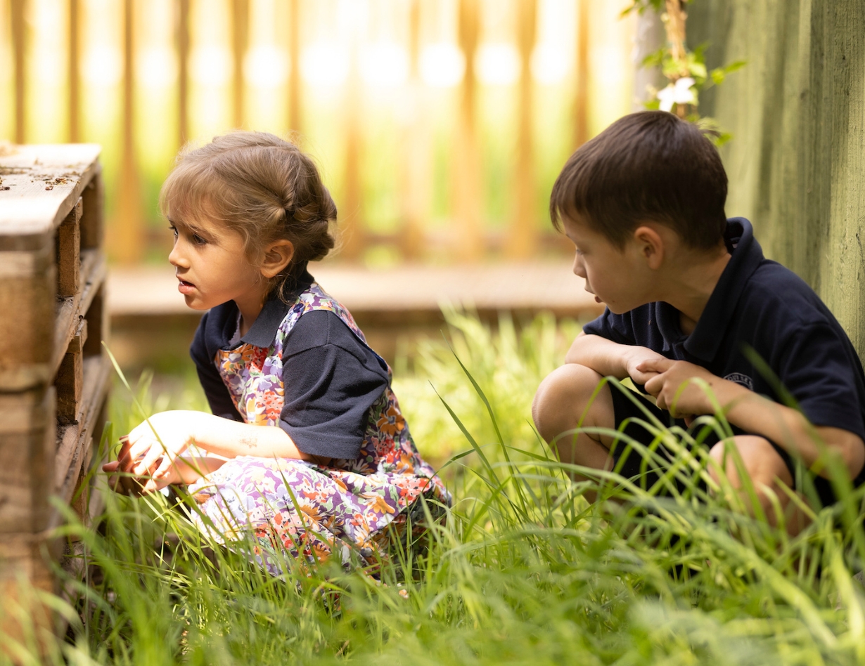 prep pupils playing in the forest school of Ibstock Place School, a private school near Richmond.