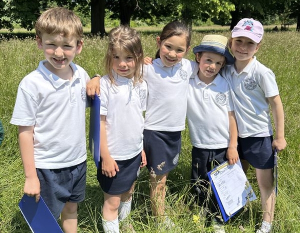 Pre-prep pupils playing in the forest school of Ibstock Place School, a private school near Richmond