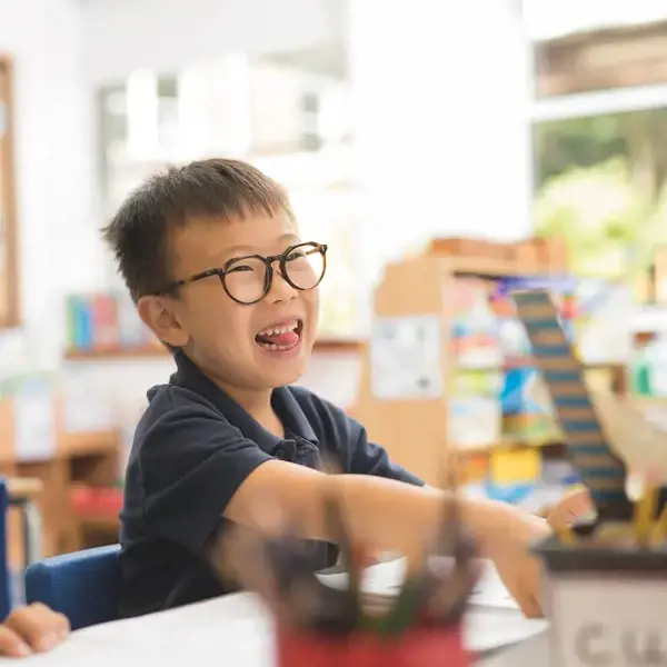 prep pupils smiling and having fun the classroom of Ibstock Place School, a private school near RichmondP