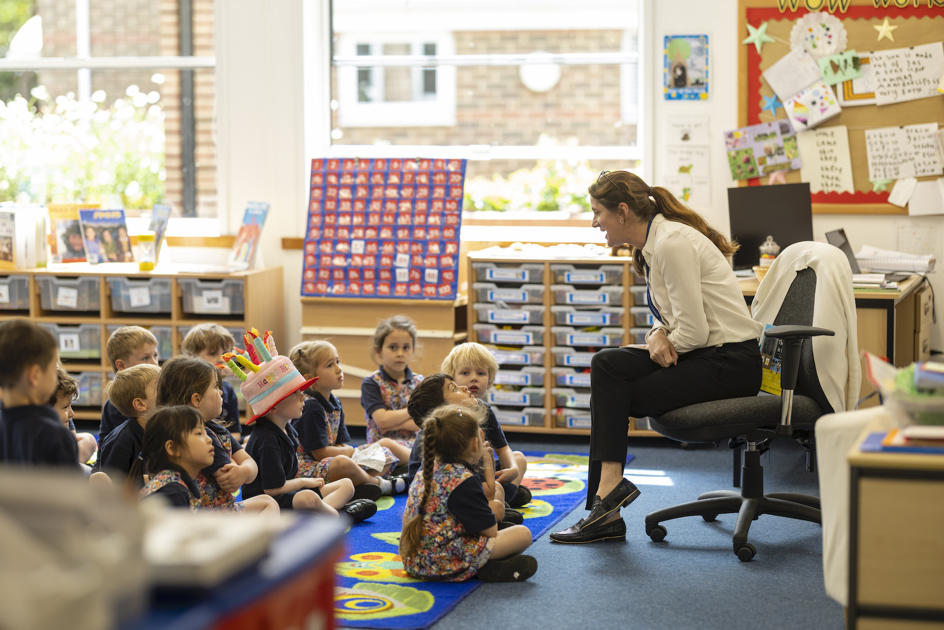 Prep teacher teaching prep pupils at Ibstock Place School, a private school near Richmond, Barnes, Putney, Kingston, and Wandsworth