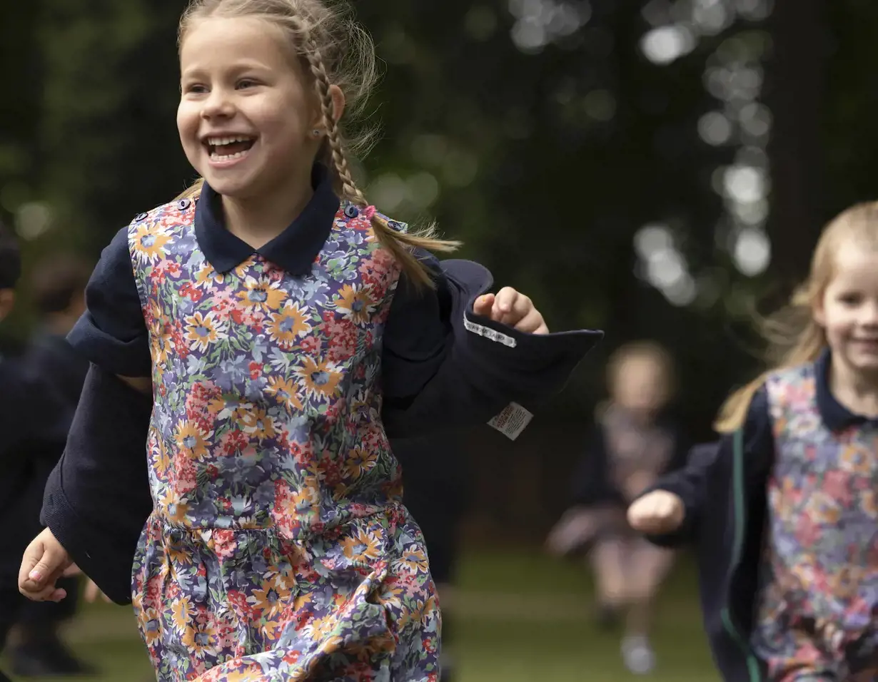 A Prep pupil enjoying herself in the playground of  Ibstock Place School, a private school near Richmond, Barnes, Wandsworth.