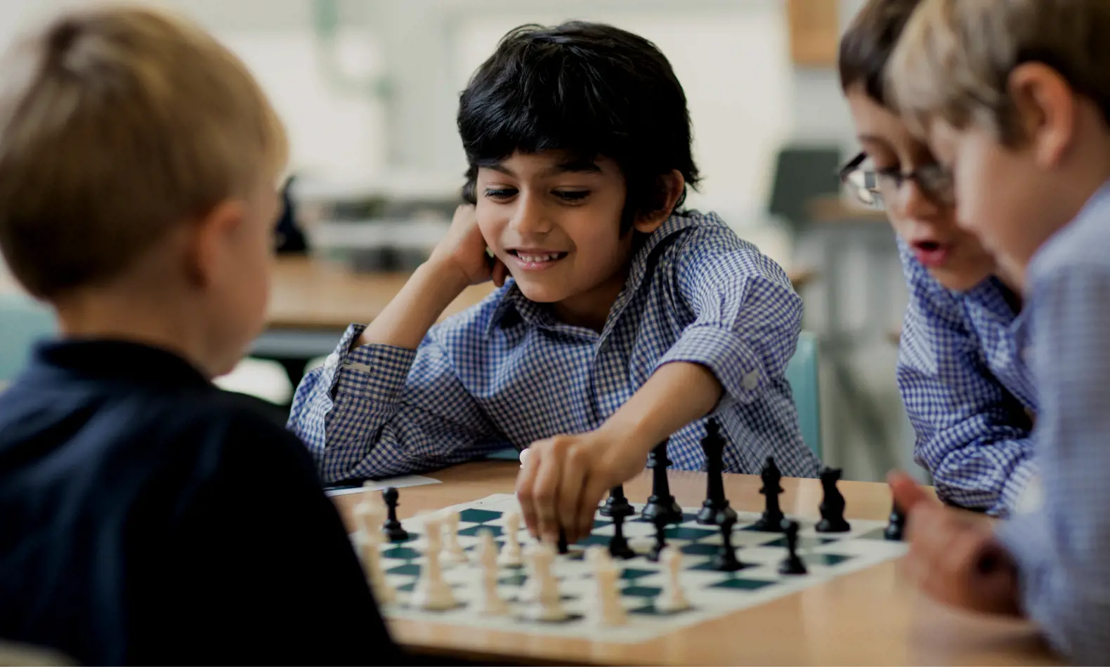 Prep pupils playing chess at Ibstock Place School, a private school for boys and girls ages 4 to 18 near Richmond.