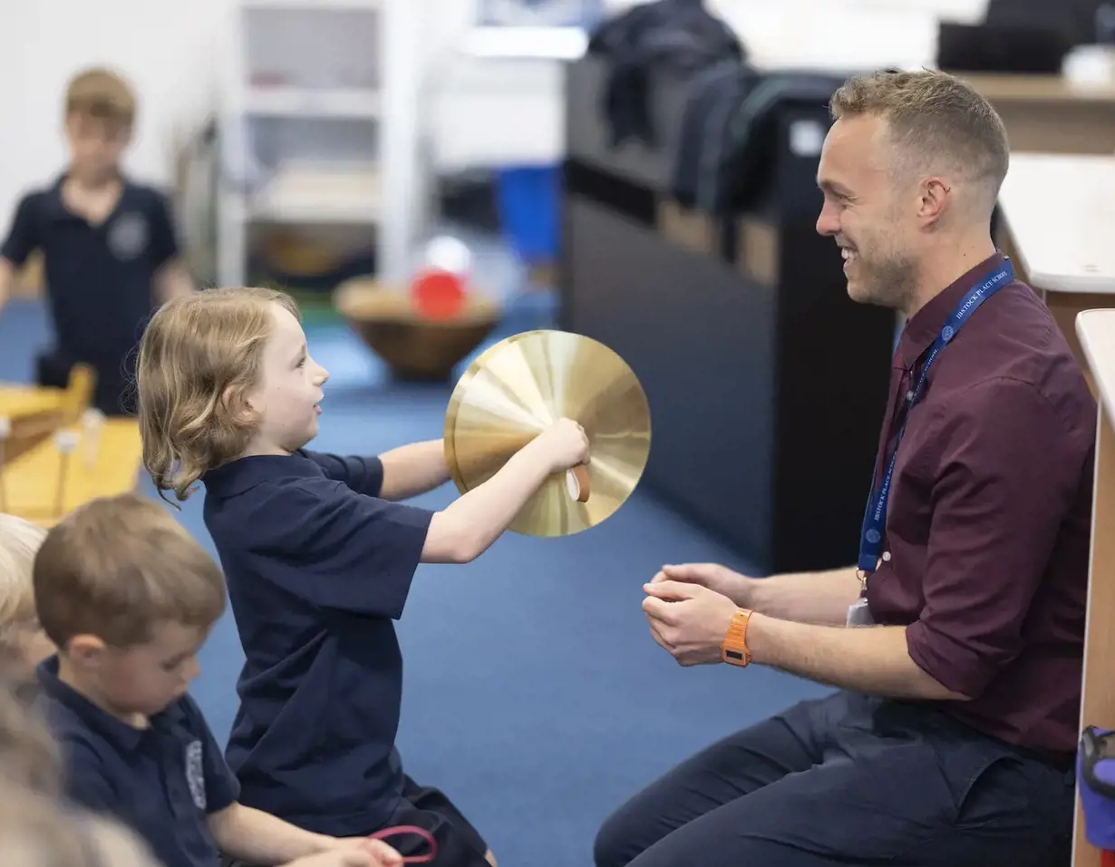 Pre-prep pupils learning music at Ibstock Place School, a private school near Richmond