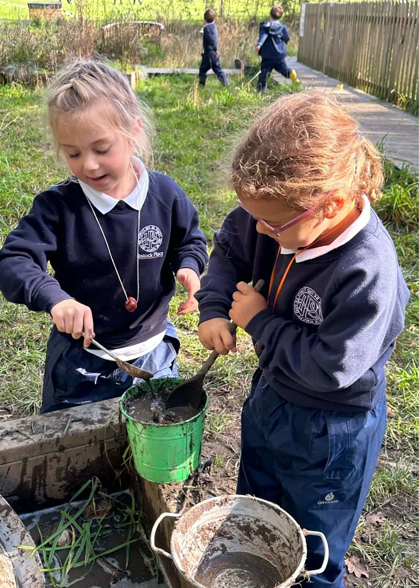 Pre-prep pupils playing with conkers, Ibstock Place School a private school near Richmond, Barnes, Putney, Kingston, and Wandsworth.