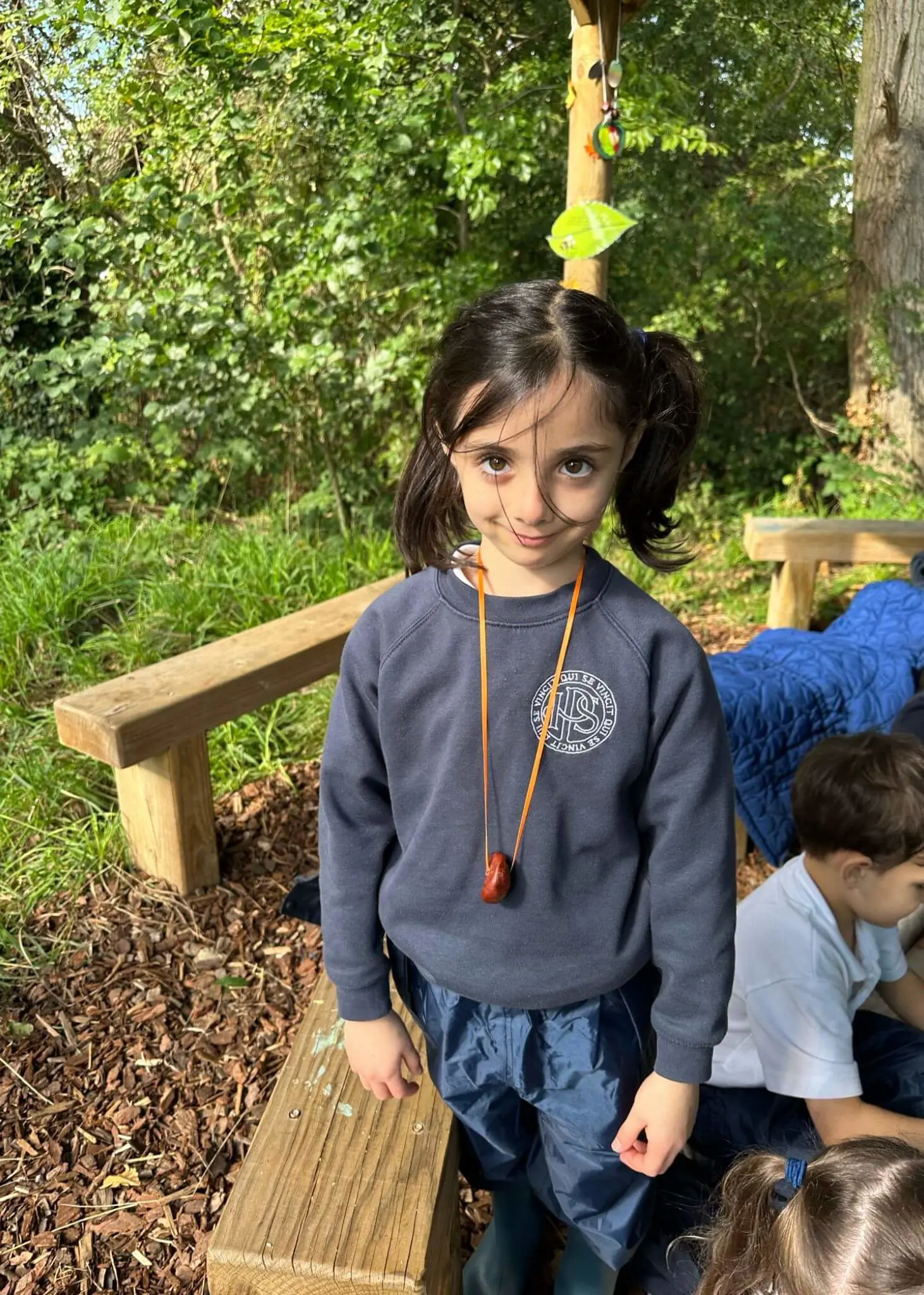 Pre-prep pupils playing with conkers, Ibstock Place School a private school near Richmond, Barnes, Putney, Kingston, and Wandsworth.