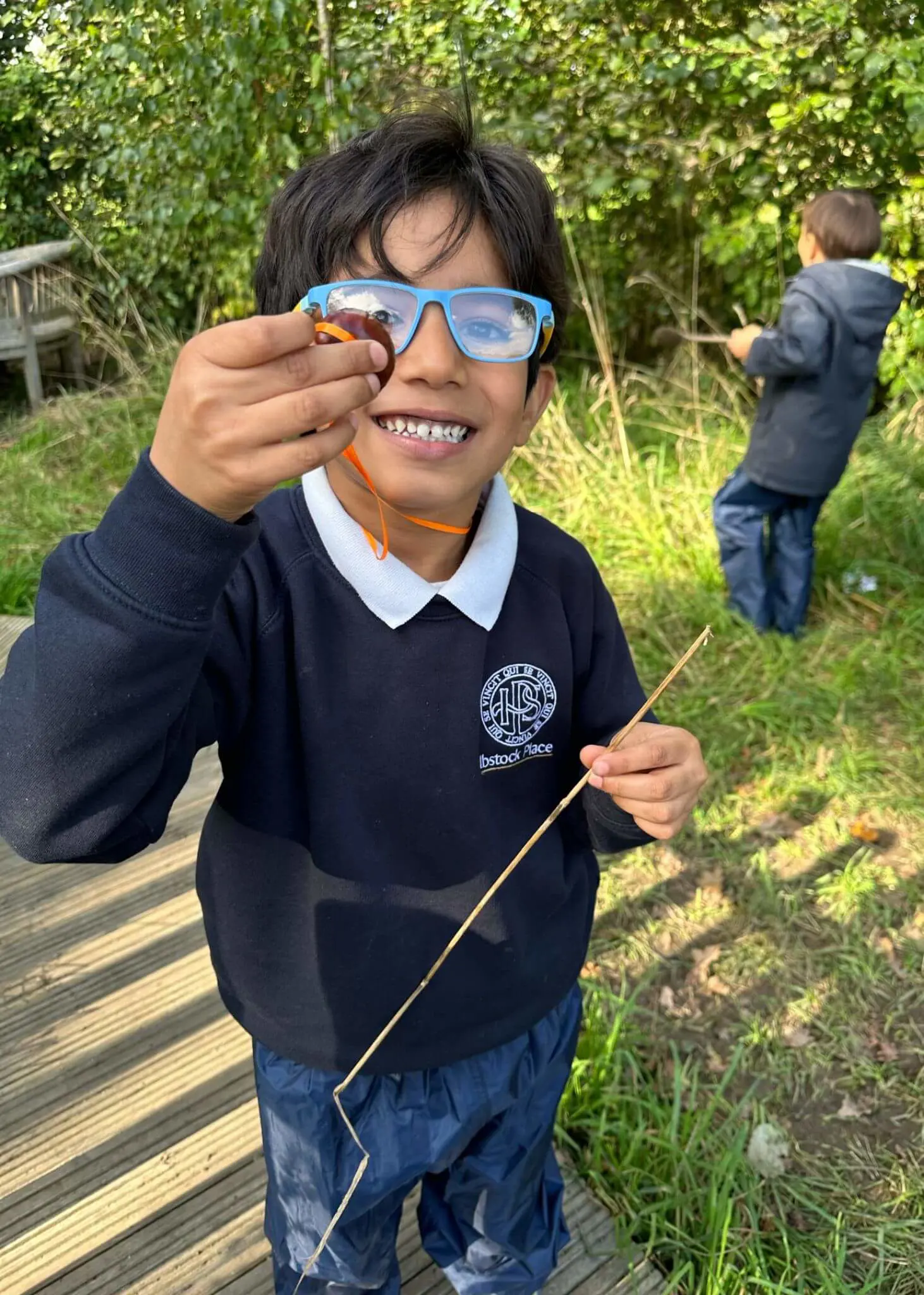 Pre-prep pupils playing with conkers, Ibstock Place School a private school near Richmond, Barnes, Putney, Kingston, and Wandsworth.