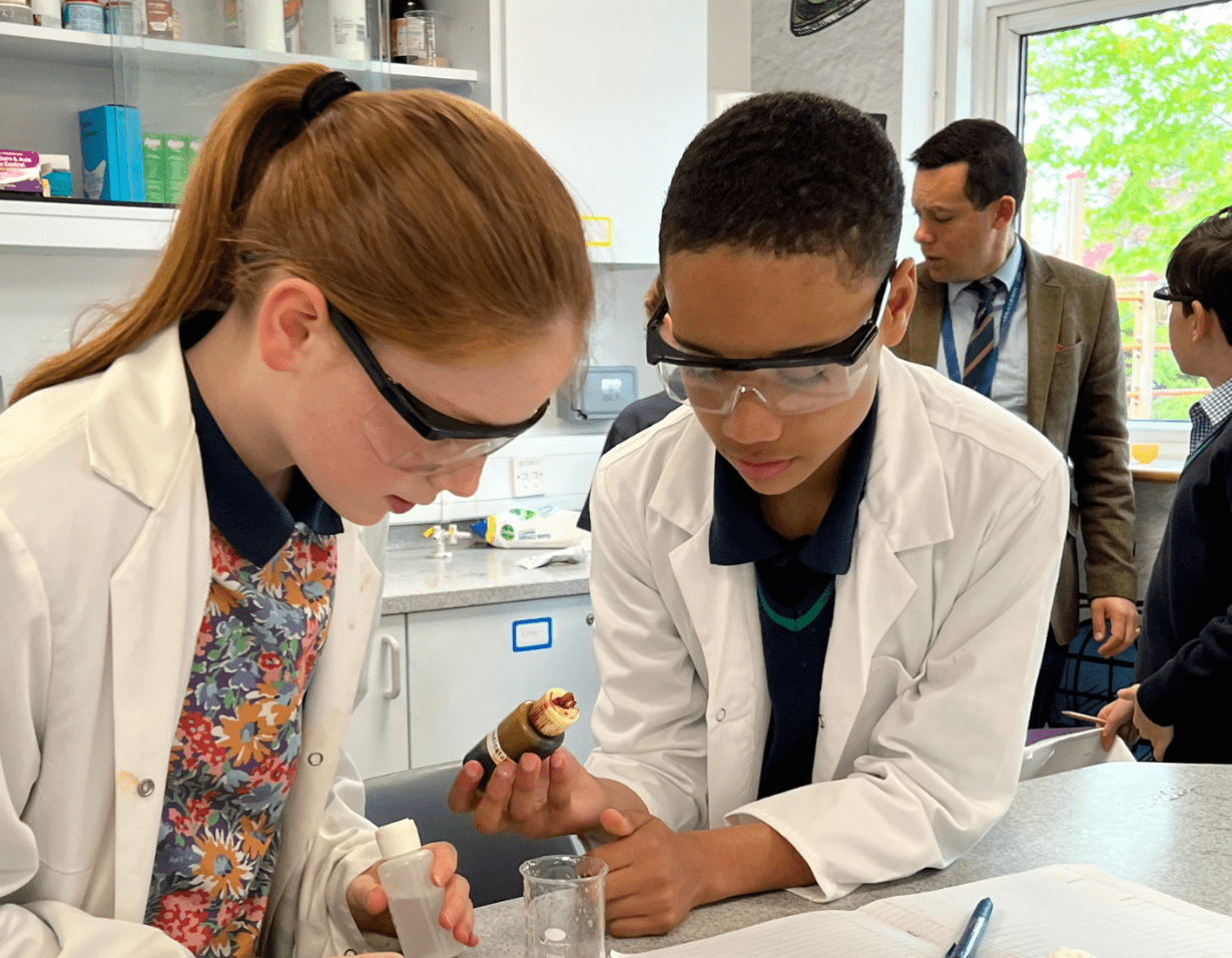 Prep pupils doing an experiment in the science lab at Ibstock Place School, a private school near Richmond.