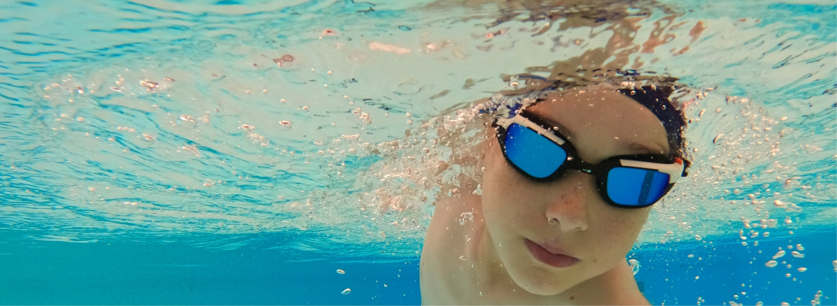 Prep pupil doing underwater swimming at Ibstock Place School, a private school near Richmond