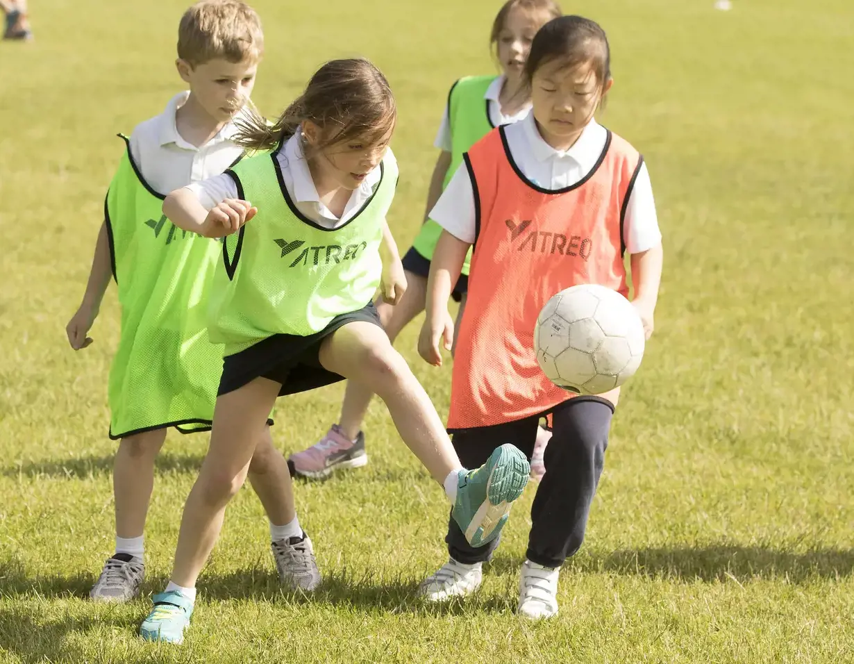 Welcome to Ibstock Place School, a leading private school in South-West London, Near Richmond, Barnes, Putney, Kingston, & Wandsworth for children ages 4-18 years. Prep pupils playing football at Ibstock Place School, a private school near Richmond.