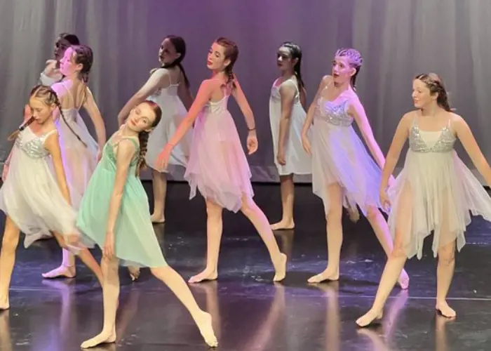 Senior girls doing a dance performance at Ibstock Place School, a private school near Richmond, Barnes, Putney, Kingston, and Wandsworth.