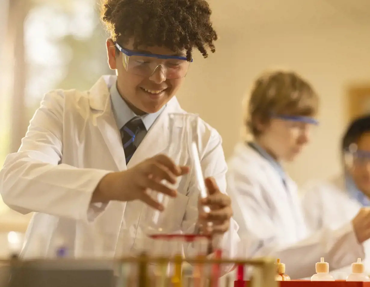 Senior pupils doing a science experiment in the lab of Ibstock Place School, co-educational a private school near Richmond, Barnes, Putney