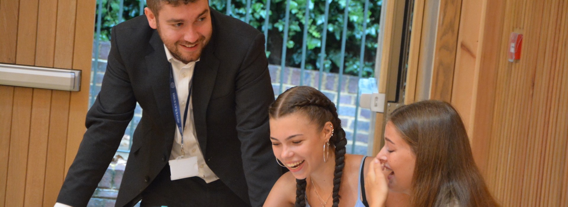 Senior pupils interacting amongst themselves Ibstock Place School, a private school near Richmond, Barnes, Putney, Kingston, and Wandsworth.