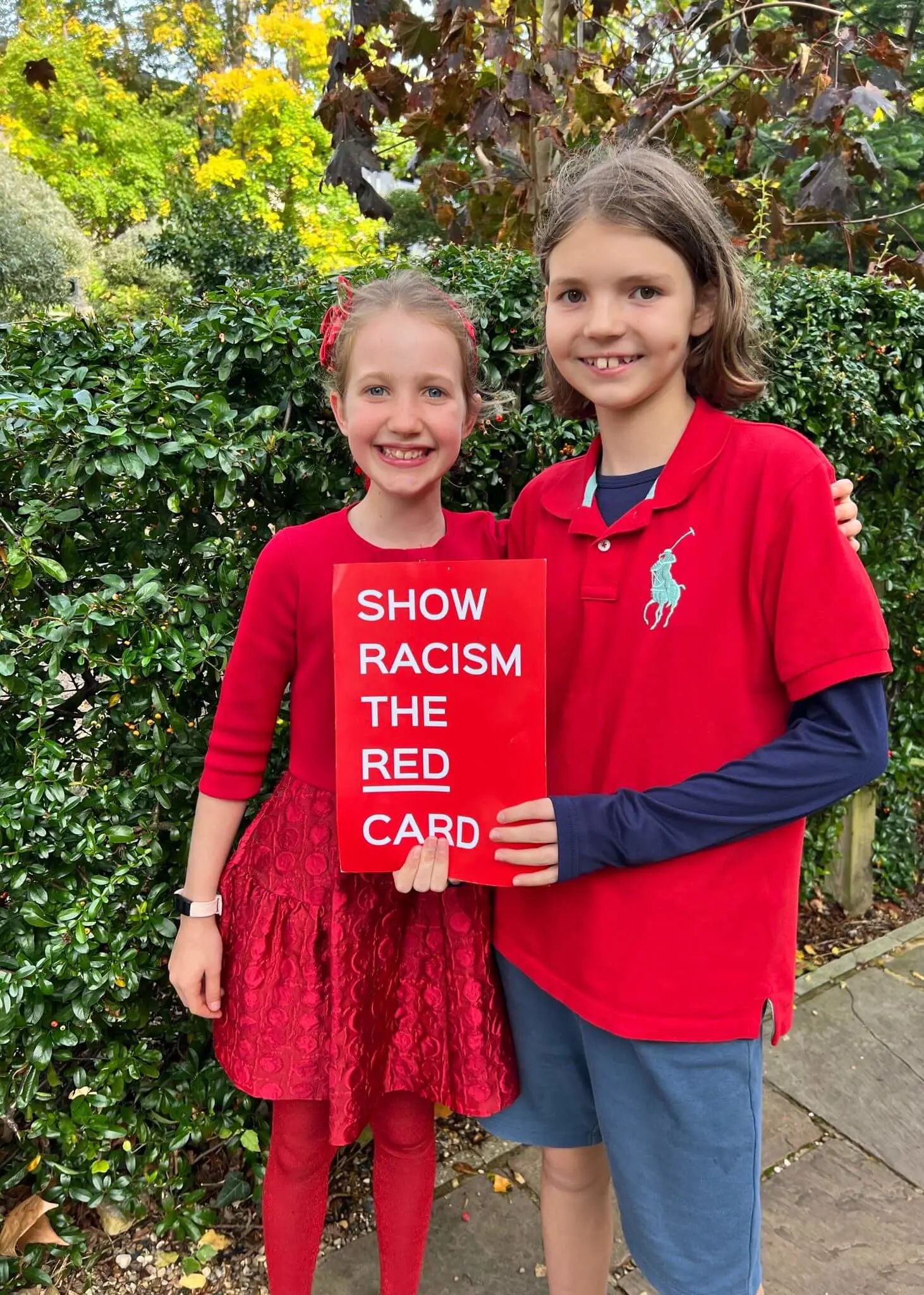 Pupils wearing red at Ibstock Place School, a private school near Richmond, Barnes, Putney, Kingston, and Wandsworth.