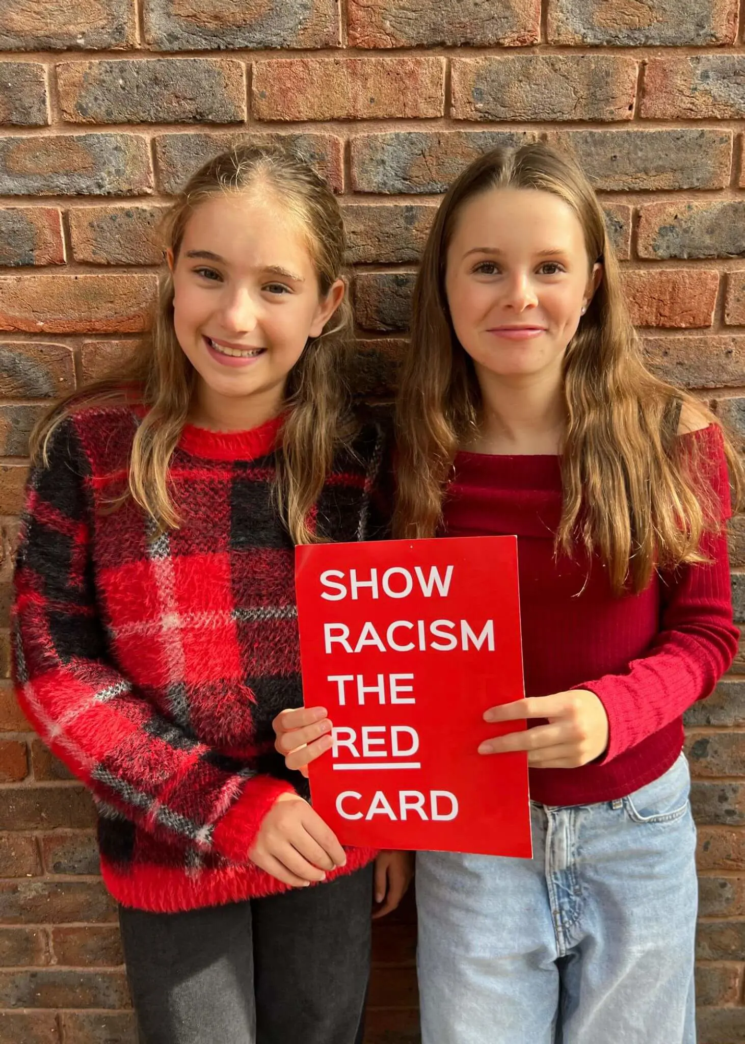 Pupils wearing red at Ibstock Place School, a private school near Richmond, Barnes, Putney, Kingston, and Wandsworth.