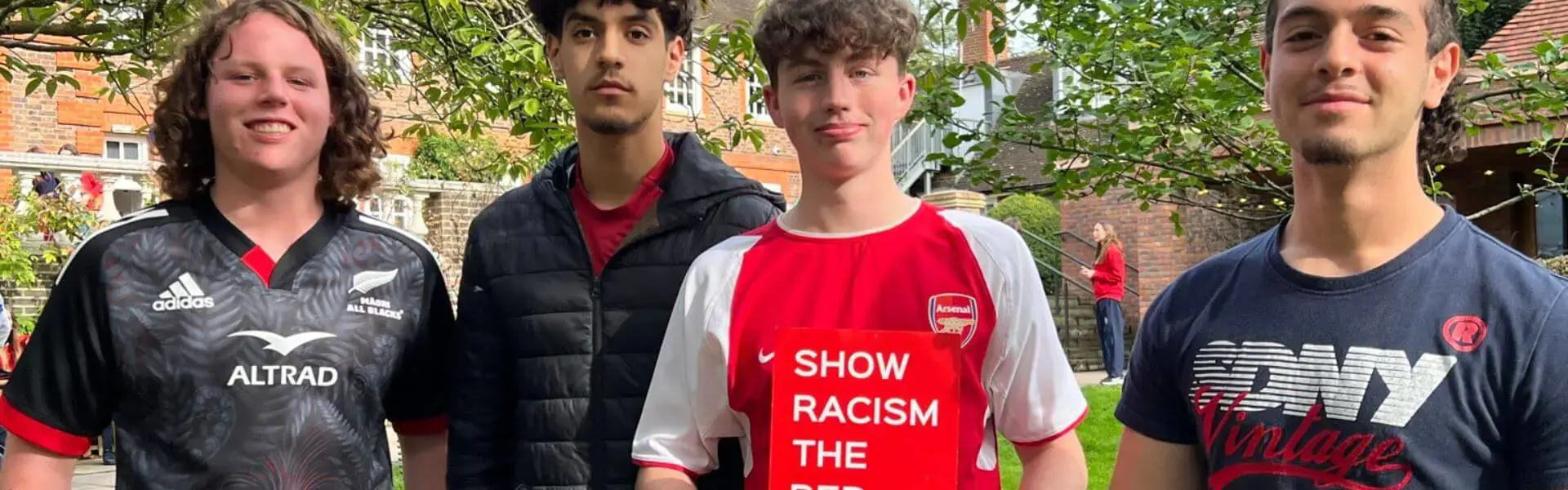 Pupils wearing red at Ibstock Place School, a private school near Richmond, Barnes, Putney, Kingston, and Wandsworth .