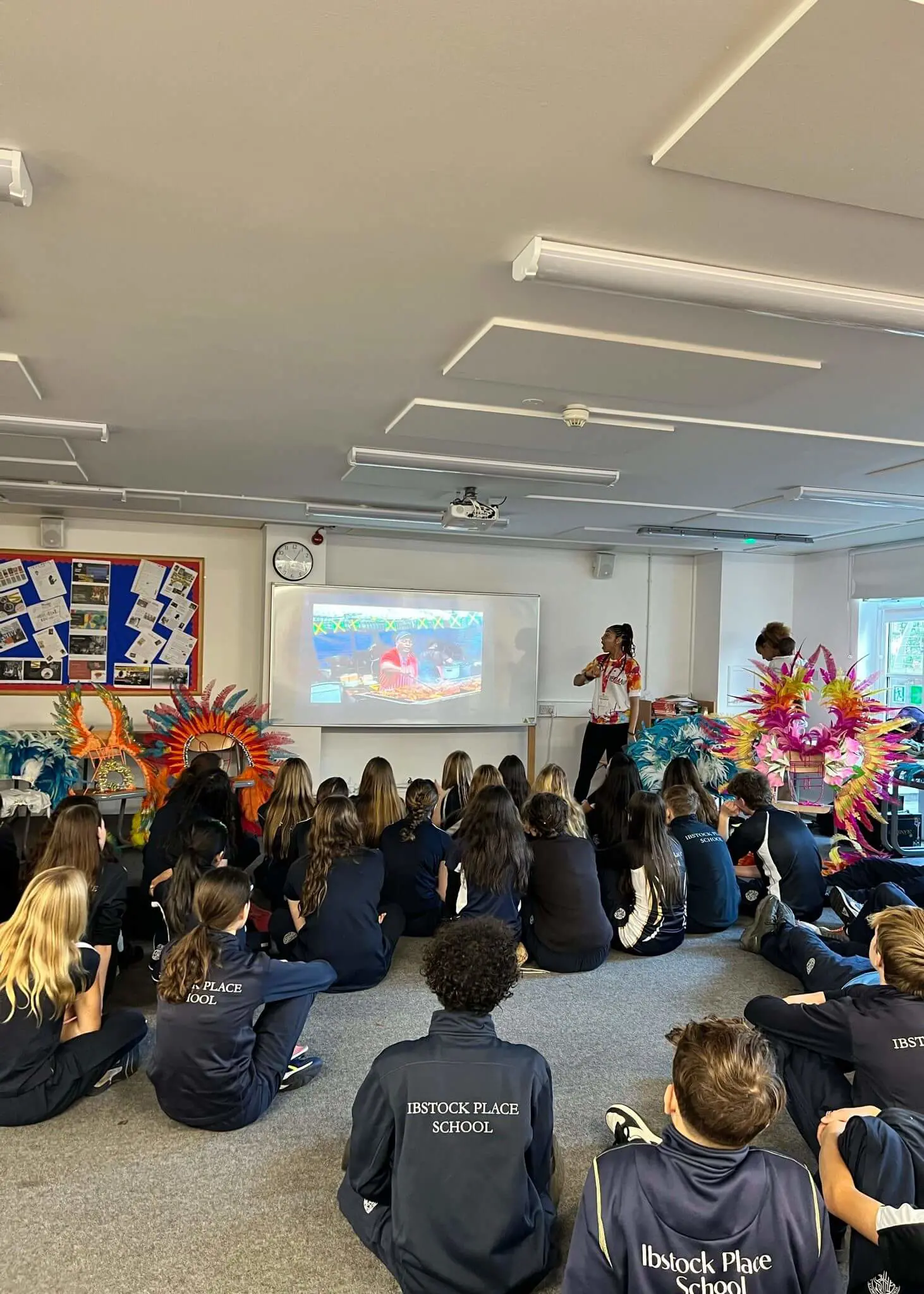 Senior pupils learning about Nottinghill Carnival  | Ibstock Place School, a private school near Richmond, Barnes, Putney, Kingston, and Wandsworth. 